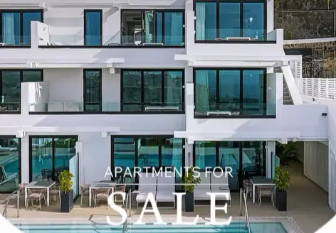 Modern white apartment building at Palmera Sea View, Patalavaca, Gran Canaria, with terraced balconies overlooking the sea